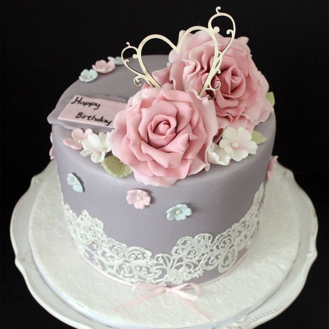Grey floral cake with delicate decorations